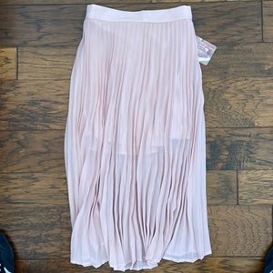 Light pink pleated midi length skirt